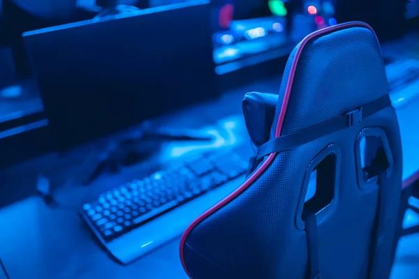 Row of SLICE gaming stations lined along the counter with monitors and chairs