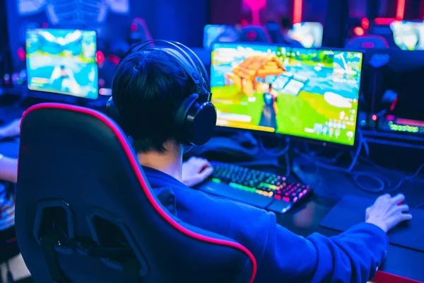 Padded SLICE booth gaming station against the wall with a wide monitor